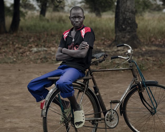 [Boy_and_Bicycle_Alebtong_Uganda_2009.jpg]