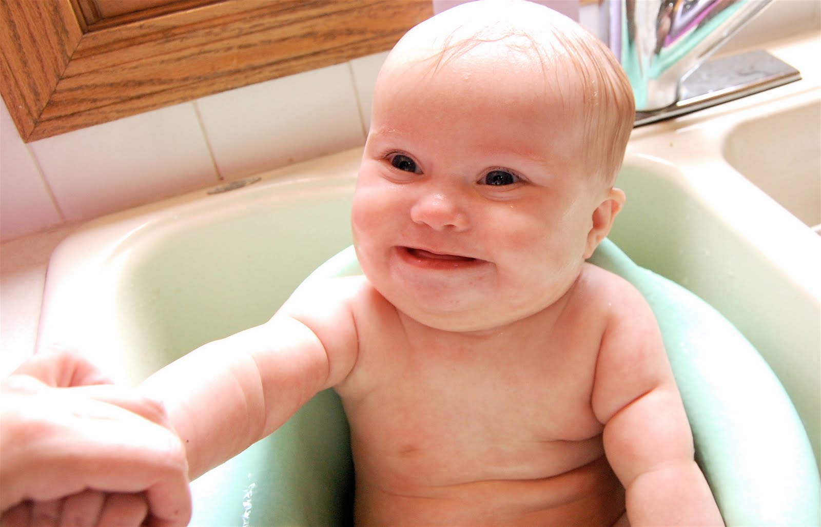 The Harnisch Family Baby Bathing in the Bumbo!