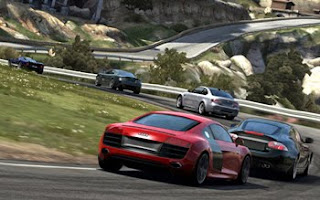 cars race round mountain roads