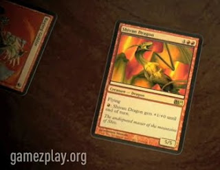 magic playing cards on table with dragon main card