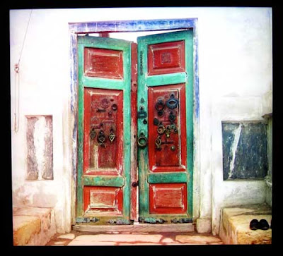 Red and green double doors with blue trim