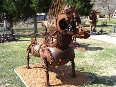 Rusted animal figure, maybe a cat?