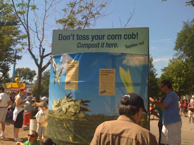 Large receptacle labeled Don't toss your corn cob! Compost it here.