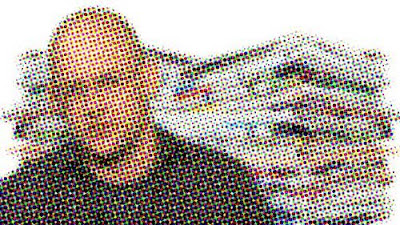 Clay Shirky in front of a pile of newspapers, rendered in half tone dots