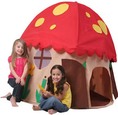 Two little girls outside a cartoonish tent resembling Amanita muscaria