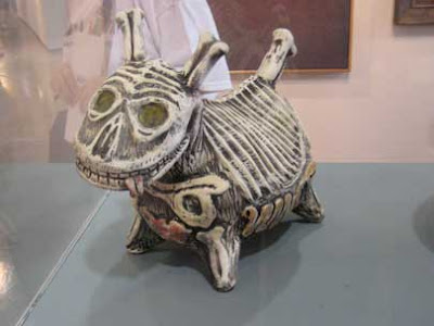 Ceramic sculpture of a dog made of bones, similar to Nightmare Before Christmas