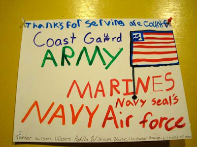 Hand-written sign by children thanking 'are' service members