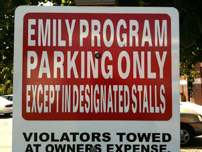 Restricted parking sign with letters so condensed they are unreadable