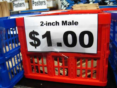 Red basket with small sign labeled 2-inch male $1.00