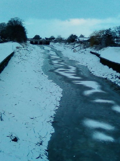 The tidal River Witham frozen over in Boston, Lincolnshire