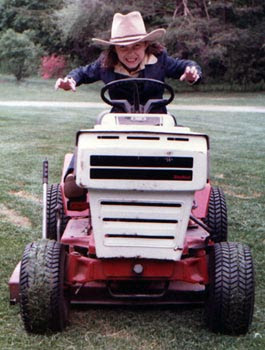 ~9 year old Claire mowing the lawn 1