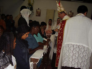 Bishop Rifan administers confirmation in a rural community of the Apostolic Administration