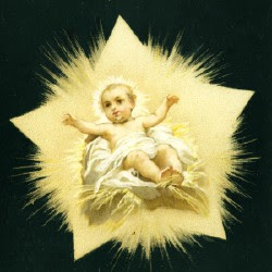 Just born Jesus Christ smiling in the bright golden manger with black background religious Christian photo