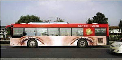 photo of a bus with eybrows painted over the wheel wells