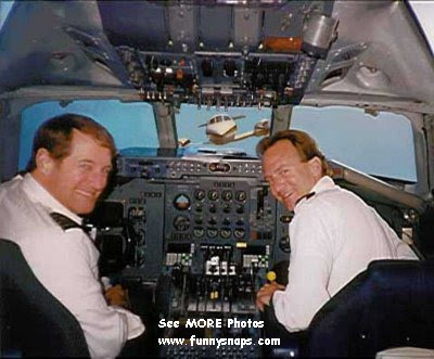 photo of two pilots smiling and a plane coming at them