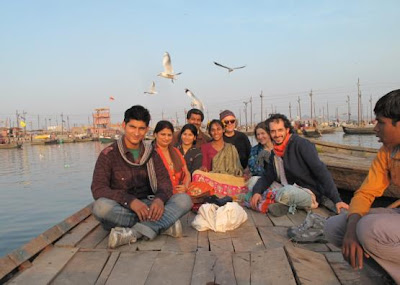 Crossing the Ganga. - (Left to right:Nishant Mallick, Guruma, Priyanka Mallick, Prem Kumar Mallick, Rani, Peter Phannke, Lisa, Joel, boy in the boat; going for a bath on the Ganga river, Allahabad.)