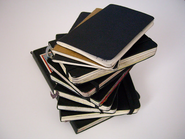 Stack of Samantha Zaza's sketchbooks of 2009.