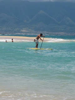 Stand up paddle long board surfing on Maui Hawaii