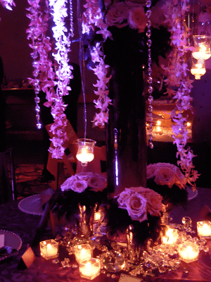Close up of floral center piece crystals and rich linens I was in love