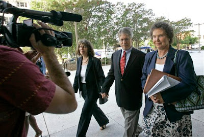 Mike Nifong (ctr), wife Cy Gurne Gurney (left), attorny Ann Peterson (rt)