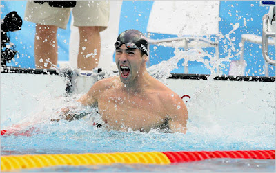 Michael Phelps celebrates victory in 100m butterfly, photo