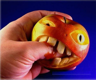 Hand Biting Unusual Apple