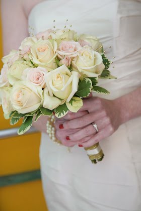 Bride holding bouquet from Christopher Mark Fine Flowers on her wedding day