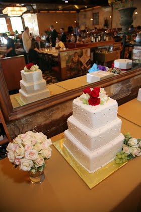 Wedding cake from Nielsen's Bakery reflected in mirror at Scoozi