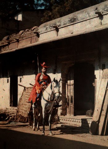 A man sits on his horse in the street of the old city of Gwalior, Madhya Pradesh - 1926