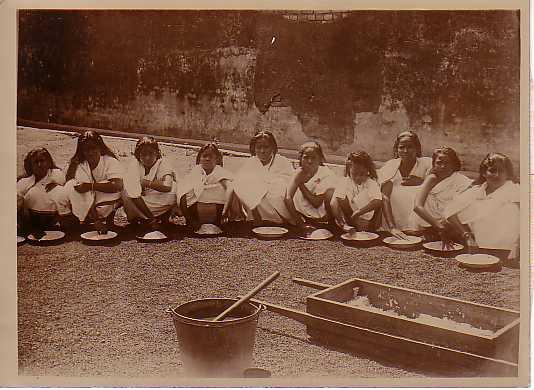 Rice-cleaning being done by girls at a mission school