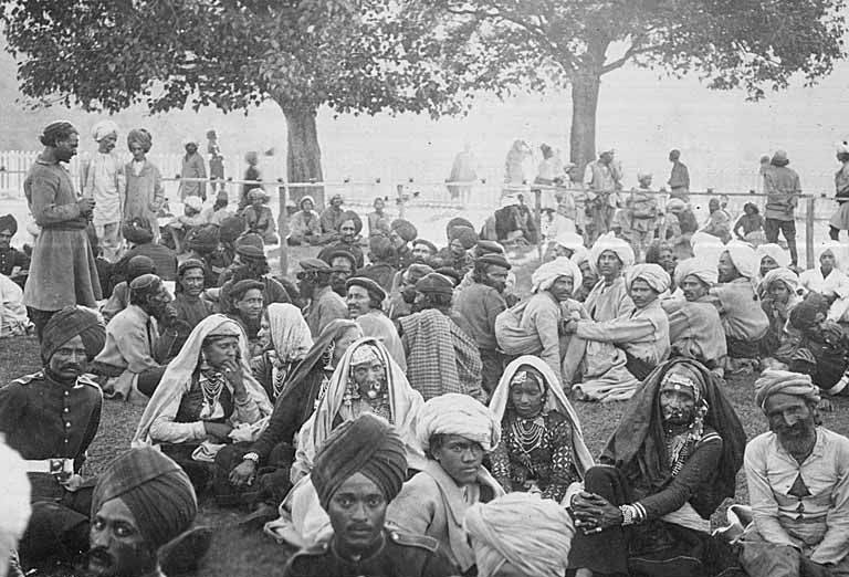 Group of Indian men and women, including soldiers in uniform, Chamba, India, ca. 1899