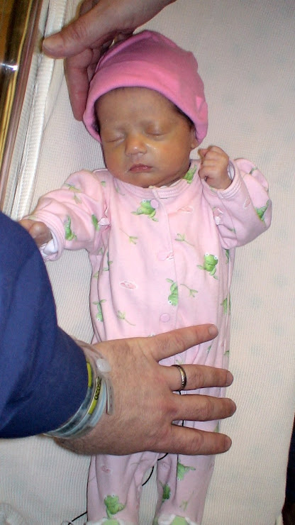 Rory, May 18, with our hands to show her size