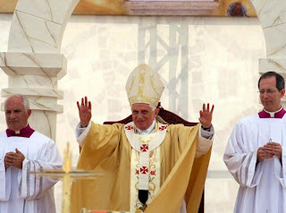 Pope Benedict XVI blessing during the celebration Mass at a stadium in Amman, Jordan image