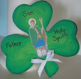 Wooden painted shamrock with Saint Patrick and The Trinity