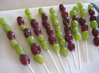 Red and white grapes on skewers