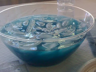 Blue lemonade in a glass bowl with ice