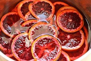 Red marmalade in a bowl with blood orange slices in it