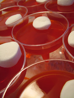 Plastic wine glasses with Red Jell-O and marshmallows in them