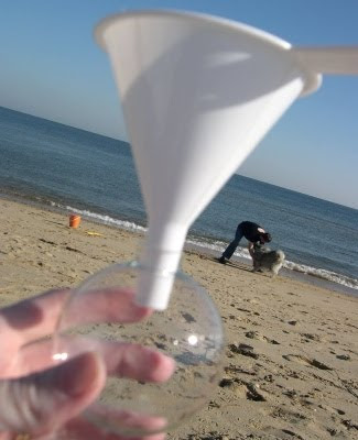 fill glass ornament on beach