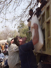 Kenneth & Jay helping to feed the Dinka