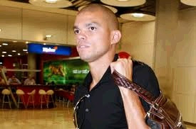 Pepe at the airport with a travel bag on his shoulder