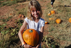 Brooke picks a pumpkin