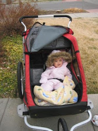 Loving her new stroller (it was a chilly day for a walk!)