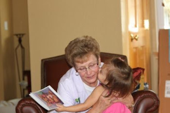Savannah giving Grandma kisses for her gift (donation to a children's charity)