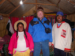 Me with President Willie &  Wife Maria, their hut, Uros floating reed Islands, Lake Titicaca