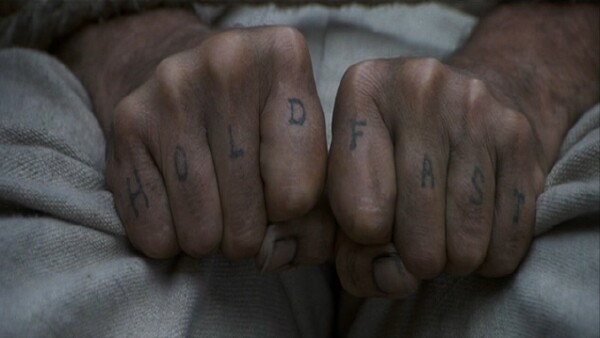 Joe Plaice's tattooed hands in