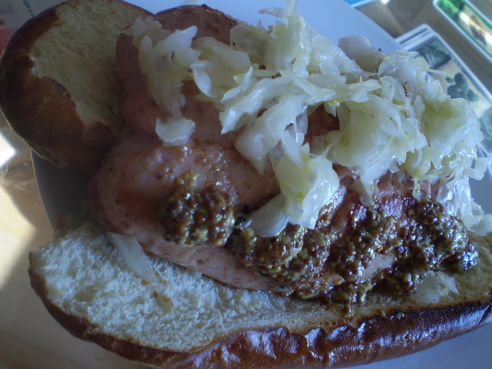 KING BOLETUS Pork and veal hot dog on a pretzel roll with sauerkraut