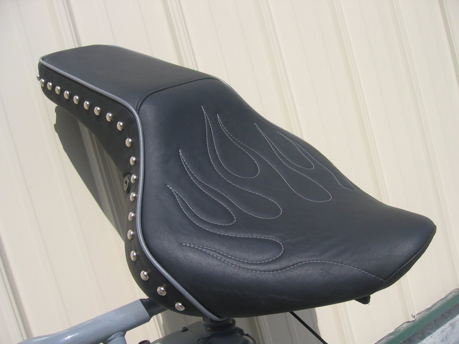Homestyle Custom Upholstery and Awning Custom Black Cycle Seat with Flames