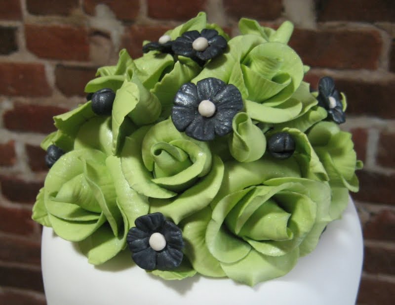 Chartreuse green roses and black were used to echo their lovely invitations