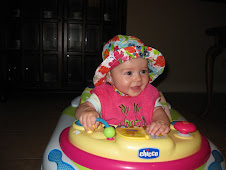 In her walker with her new hat